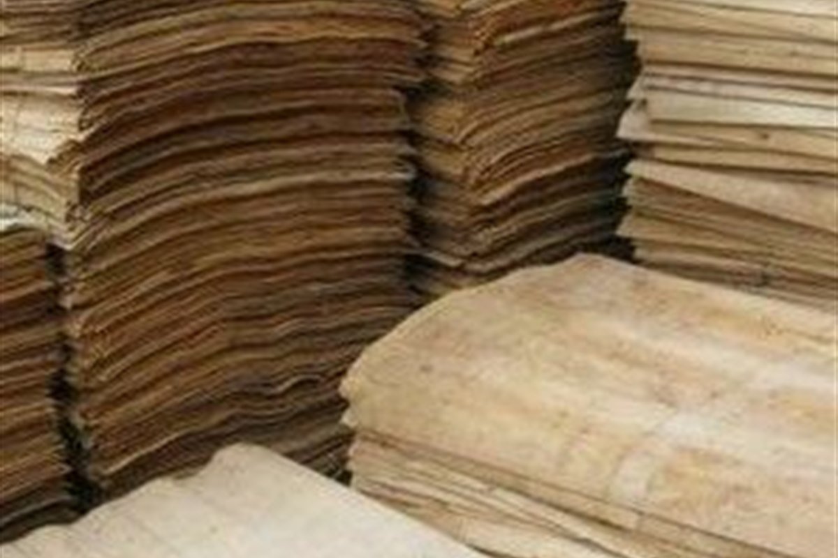 Bundled core veneer sheets in a production facility